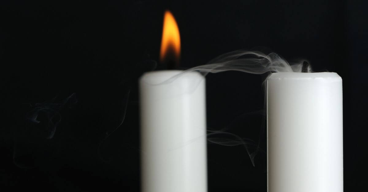 Two candles burning out.