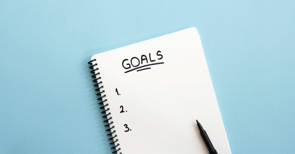 A notebook with a list of goals.