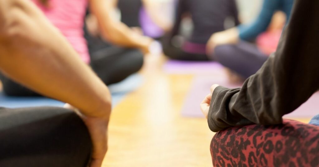 A group meditating in a class.