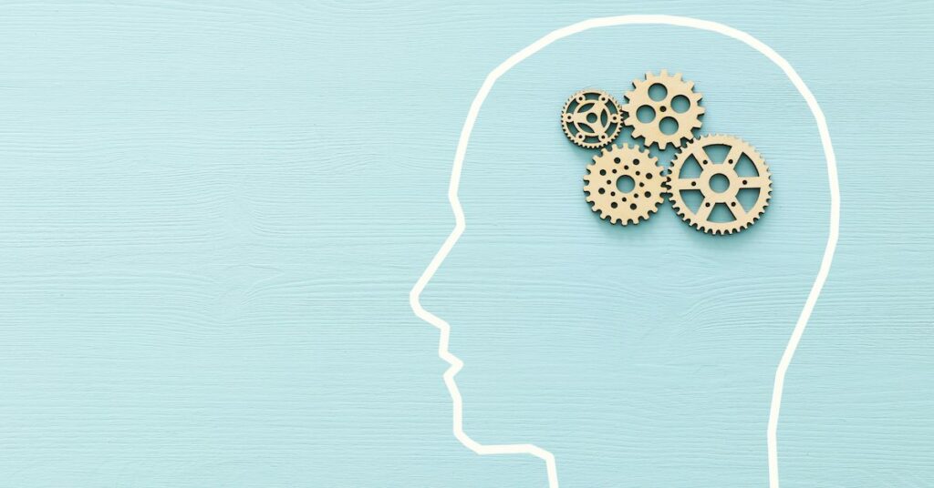 A mind concept featuring gears where the brain is.