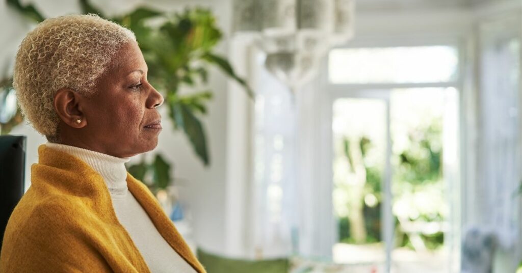 A woman practicing mindfulness at home.