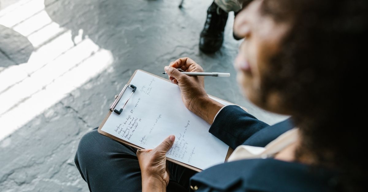 A therapist taking notes.