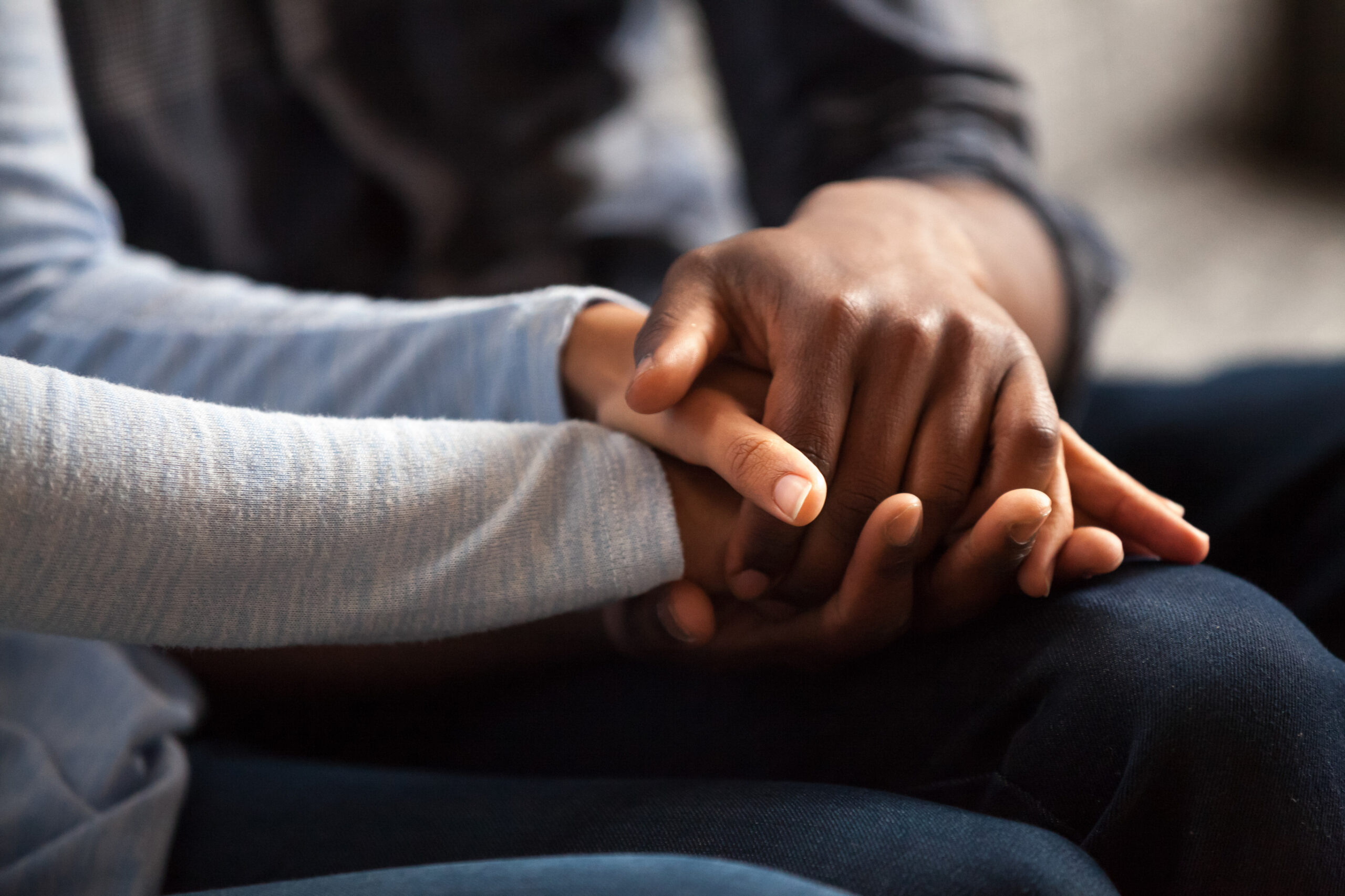 African American family holding hands