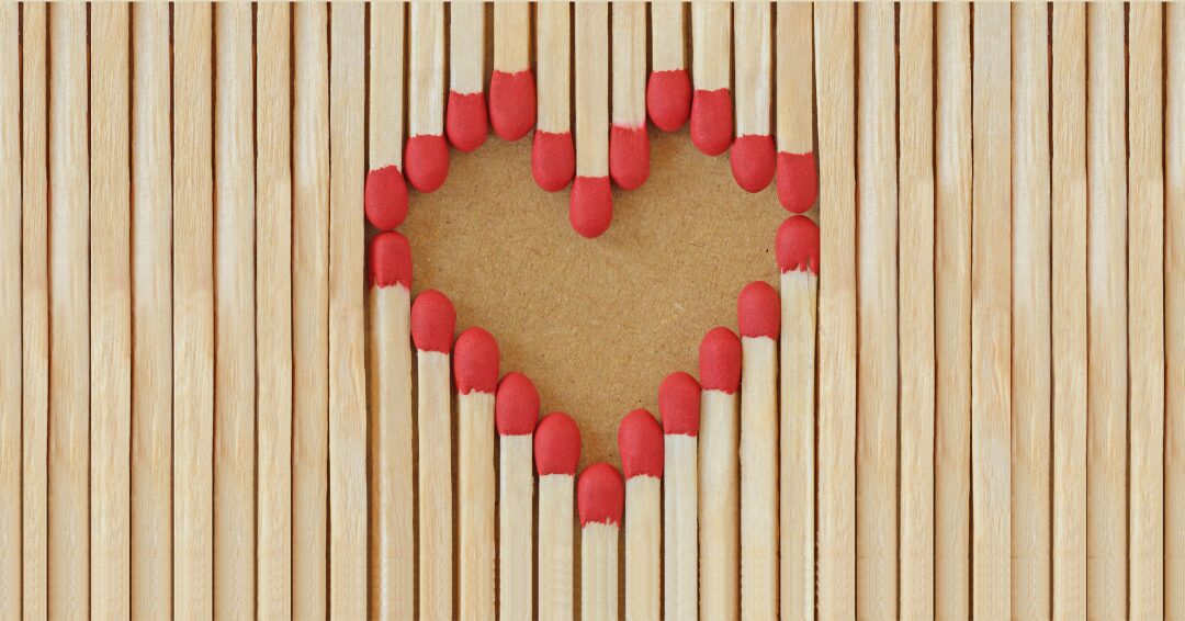 Heart design made from the heads of matches coming together