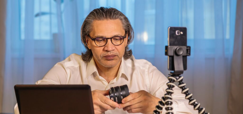 A man sets up a camera to record a video for social media