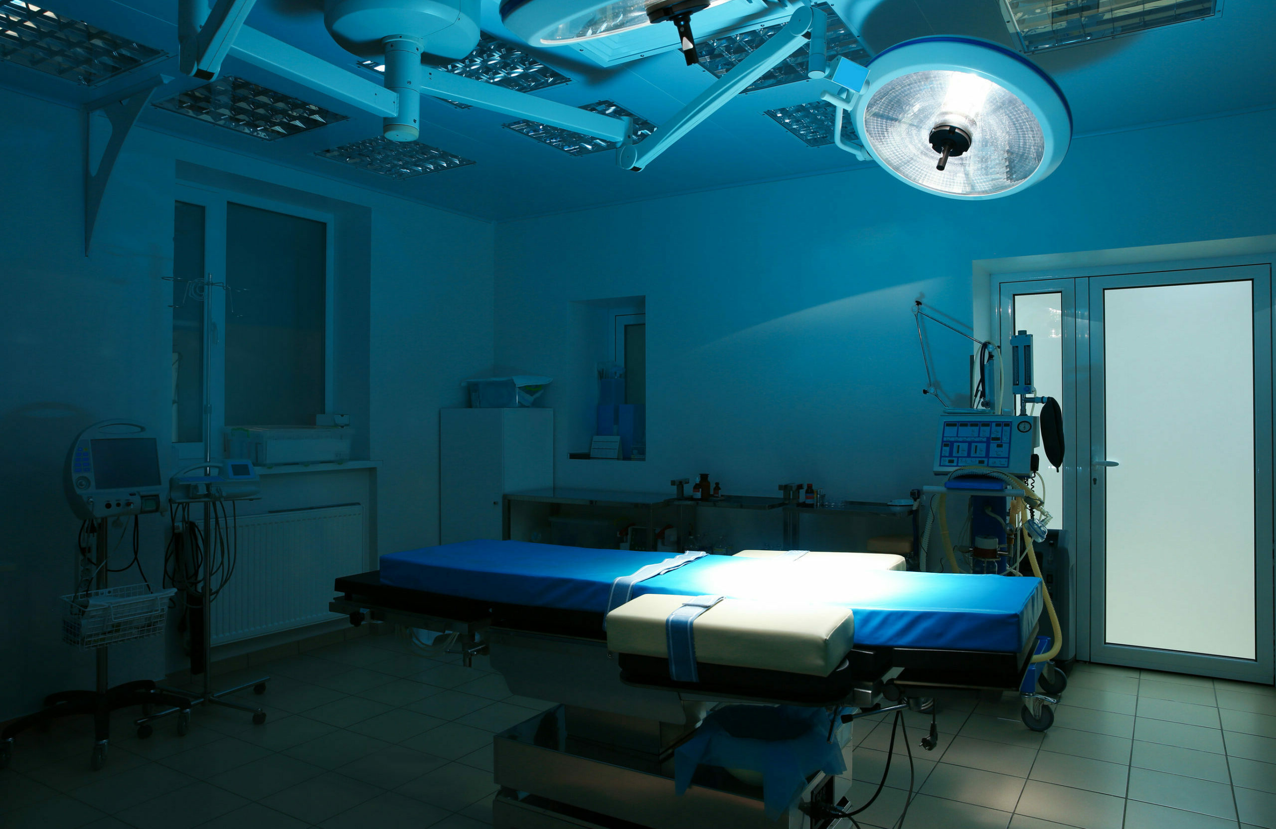Empty operating room with blue table